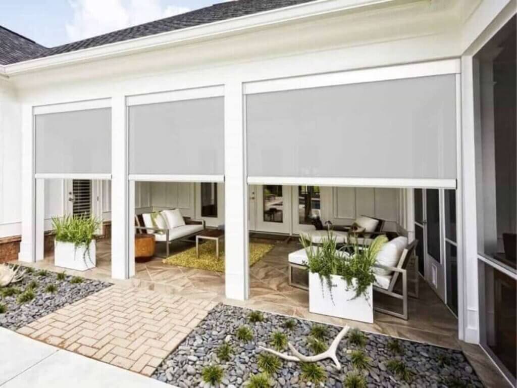 Exterior roller shades offer UV protection and reduce heat for comfortable outdoor living.