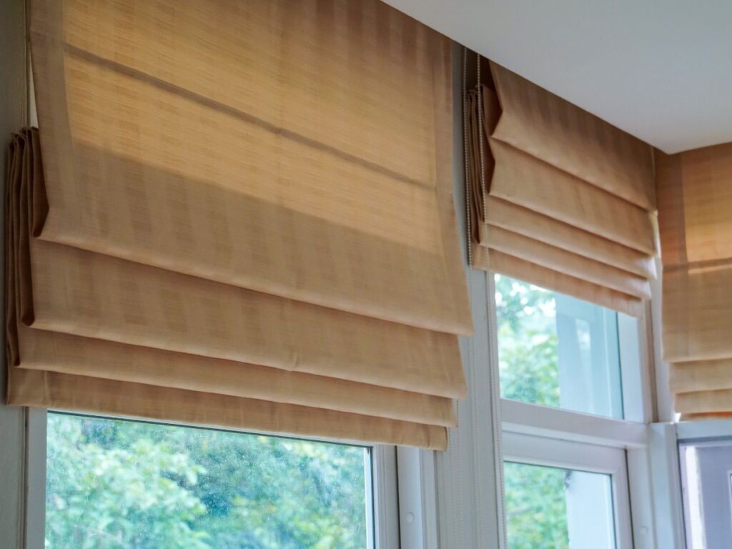 insulate your living room with roman shades