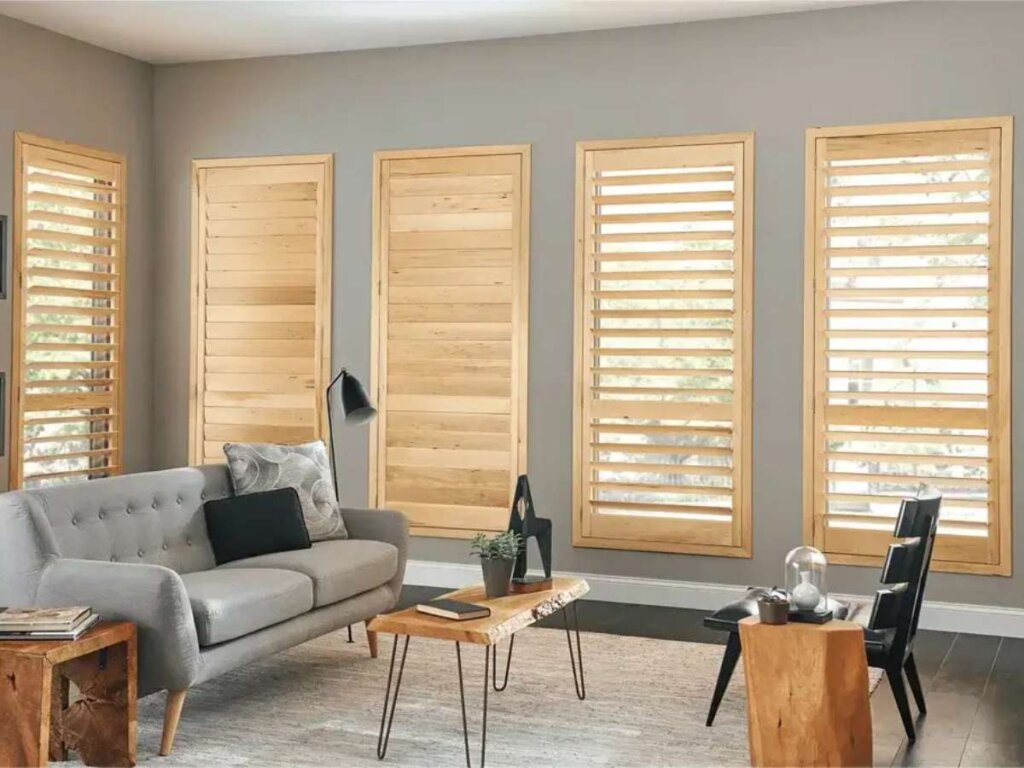 Wood shutters adding warmth and charm to the living room decor.