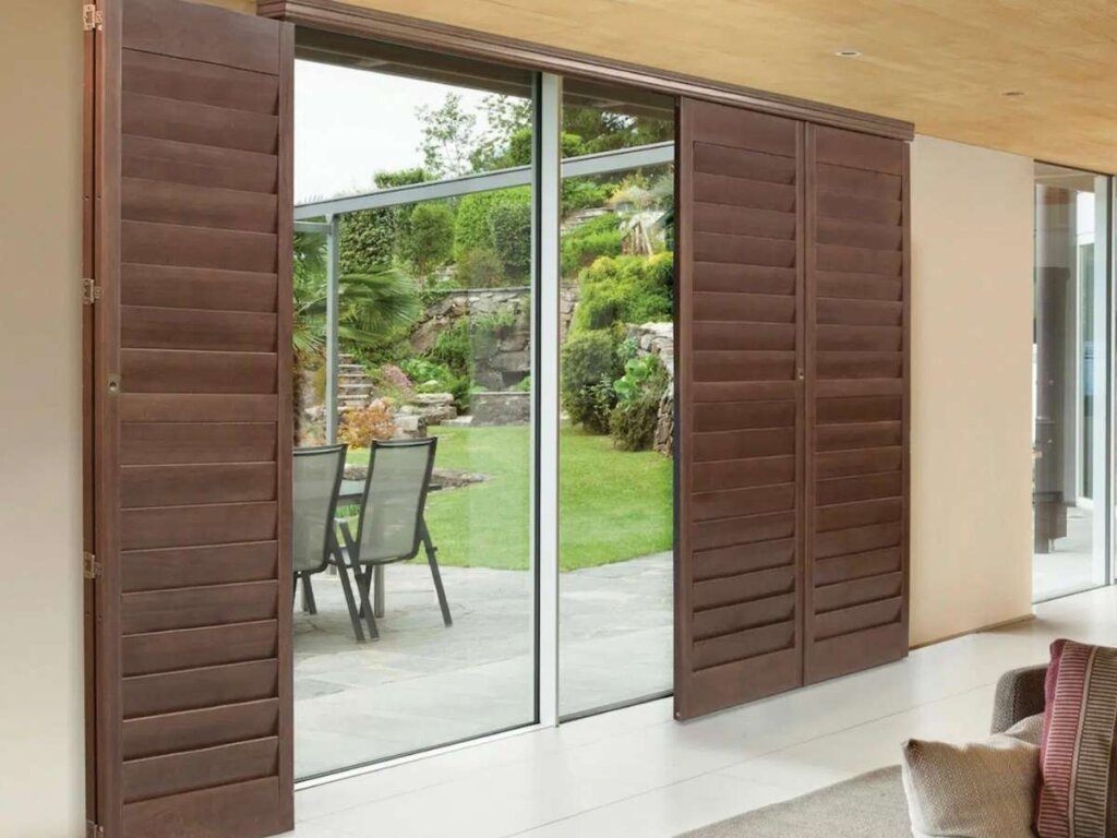 stylish shutters on sliding doors adding aesthetic appeal and elevating room décor